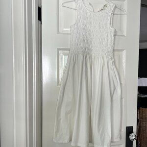 T TAHARI SLEEVELESS, SMOCKED WHITE COTTON DRESS